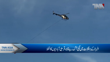 Winds helping in battle against fire threatening northern Alberta town