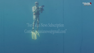 The First Underwater Color Photo